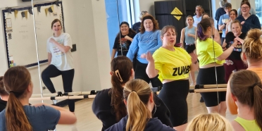 Theology professor Emily Kahm teaches body positive Zumba at College of Saint Mary.