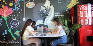 College of Saint Mary students work on a puzzle in the new student lounge on campus.