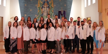 College of Saint Mary physical therapy students received white coats during Clinical Commencement Ceremony