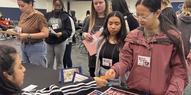 College of Saint Mary healthcare students participate in a poverty simulation.