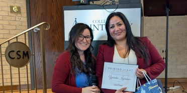Omaha business owner Yuridia Igbowke receives her Shining Light Award at College of Saint Mary