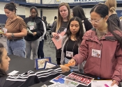 College of Saint Mary healthcare students participate in a poverty simulation.