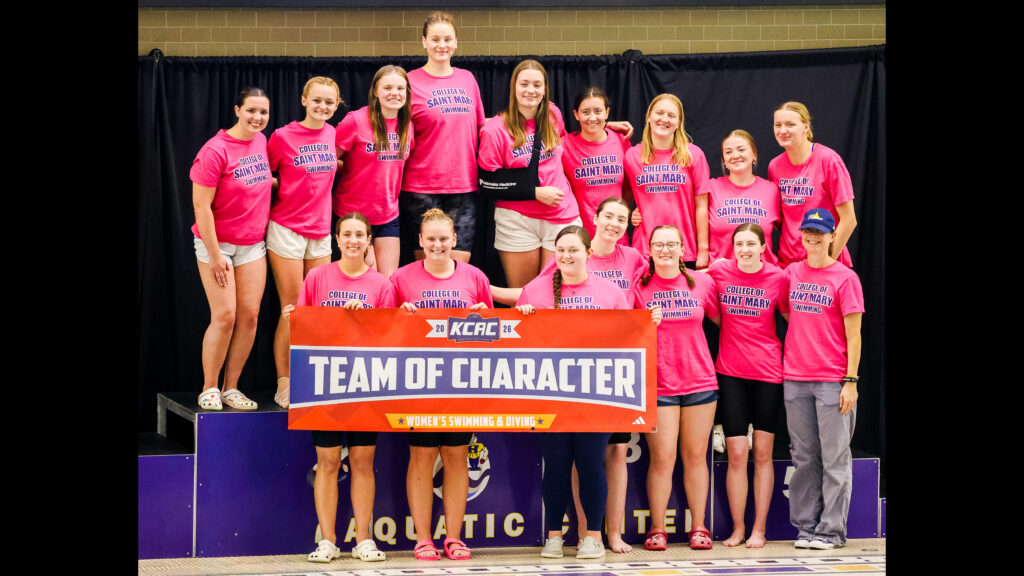 The Flames swim team at KCAC competition