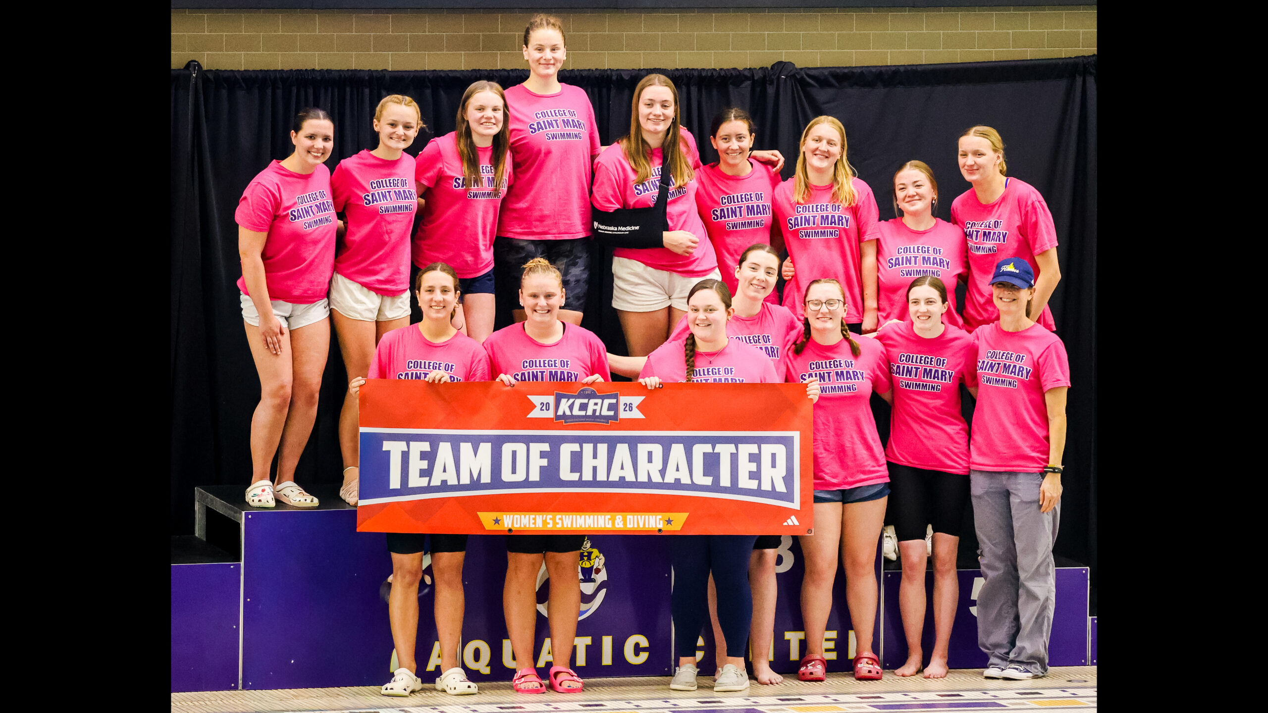The Flames swim team at KCAC competition