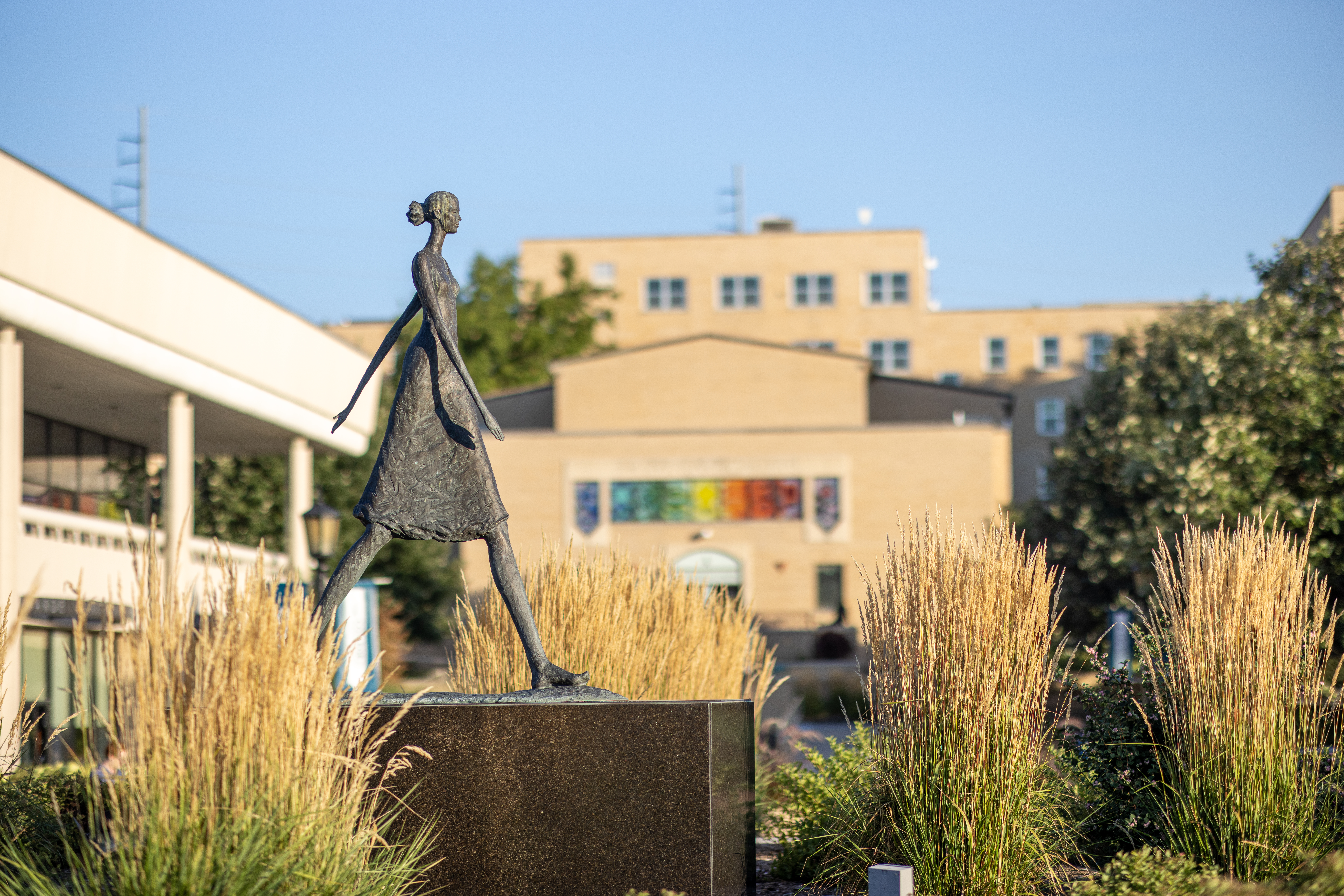 walking woman statue