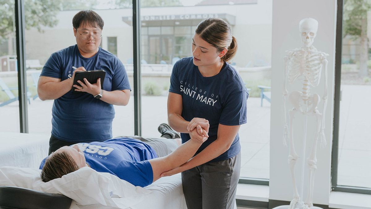College of Saint Mary hybrid physical therapy students practice evaluations and physical examinations on campus.