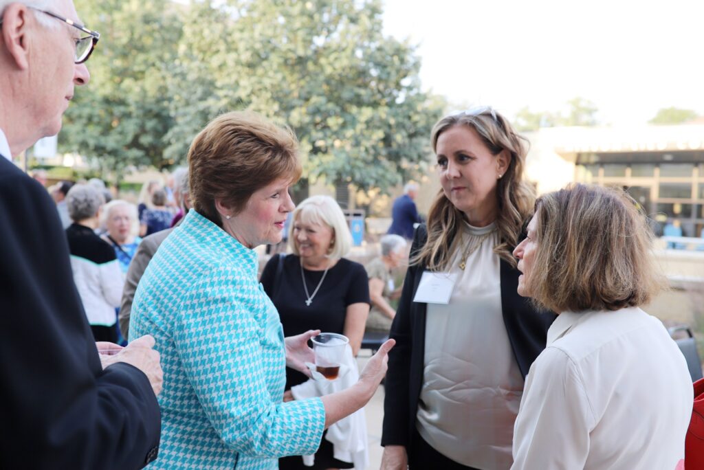 ground of people talking in an outdoor setting