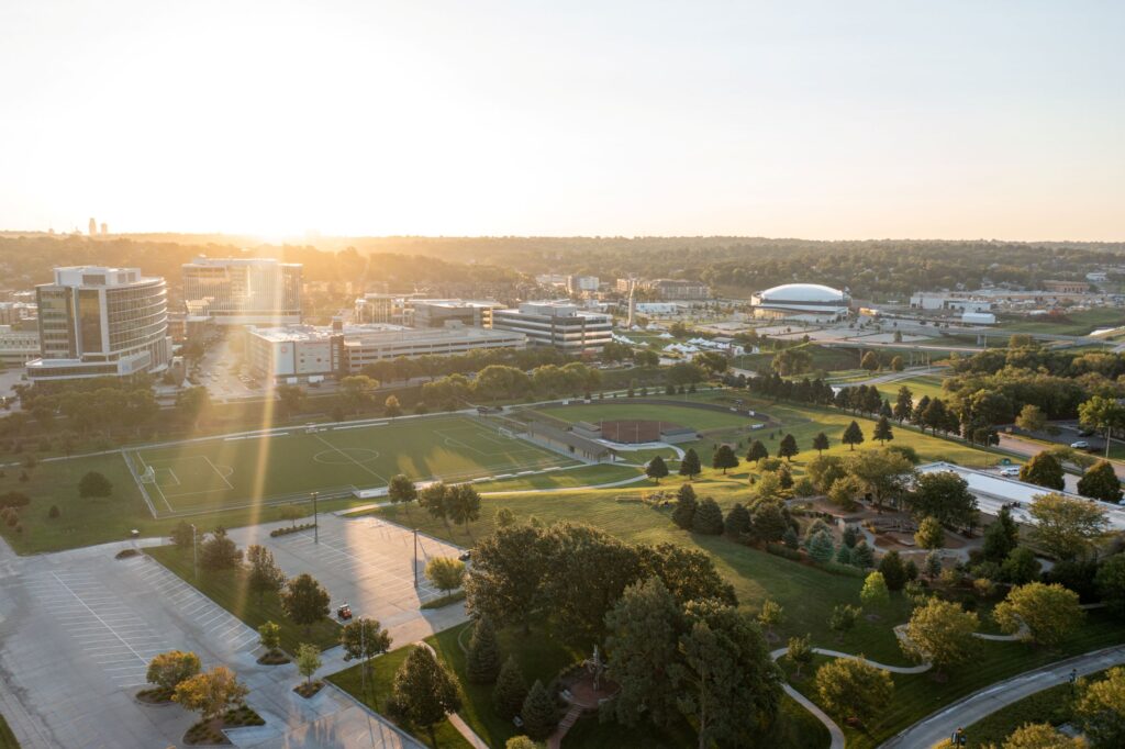 Aerial view of College of Saint Mary's campus and athletic fields with Aksarben village in the background.