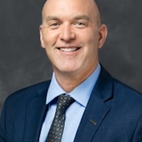Headshot image of Aaron Gilson.