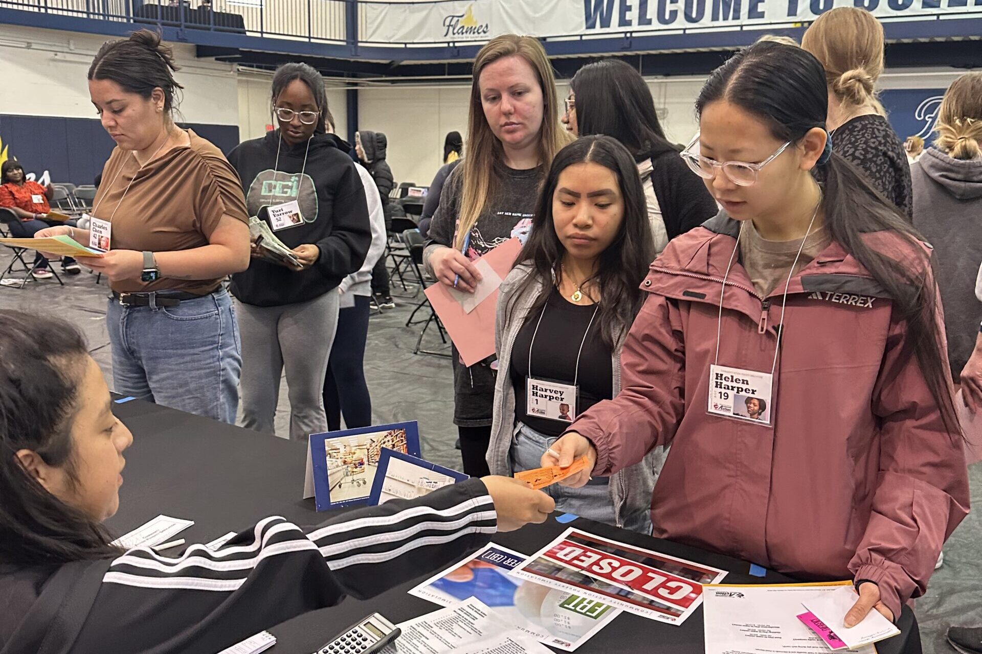 Students participate in a poverty simulation on campus.