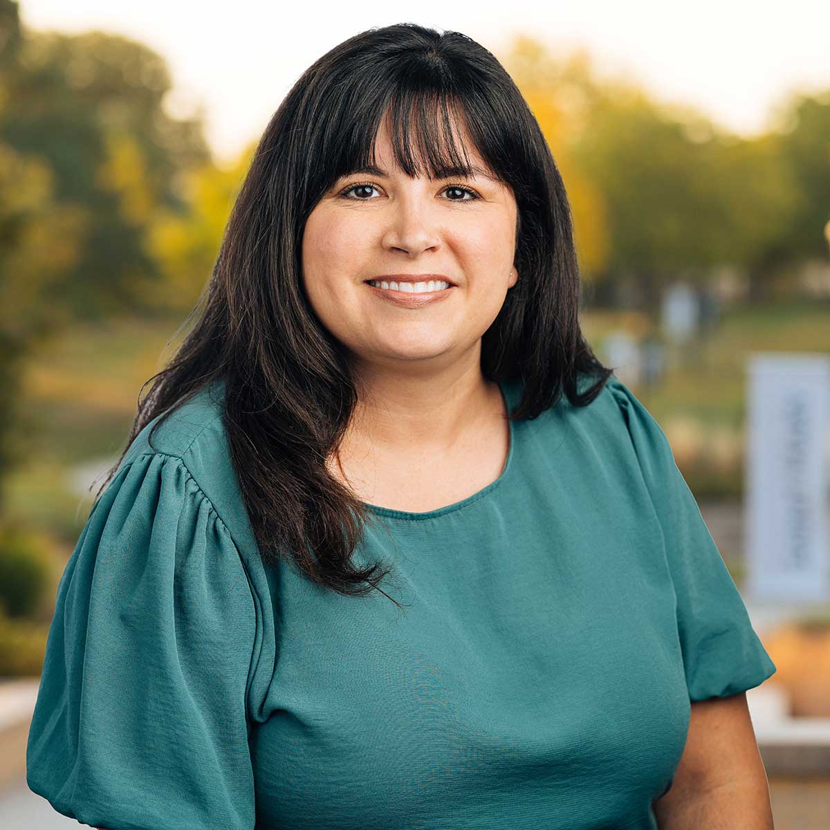 Headshot image of Sabrina Riggins.