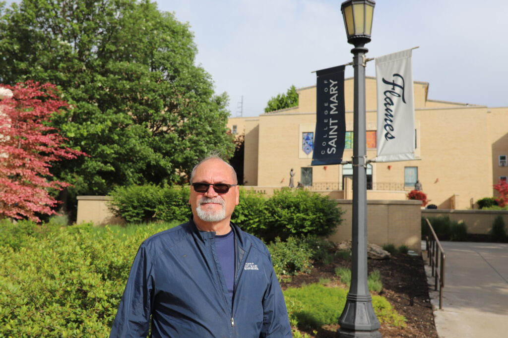 Leroy Peters, assistant director of facilities, stands in the plaza on campus.