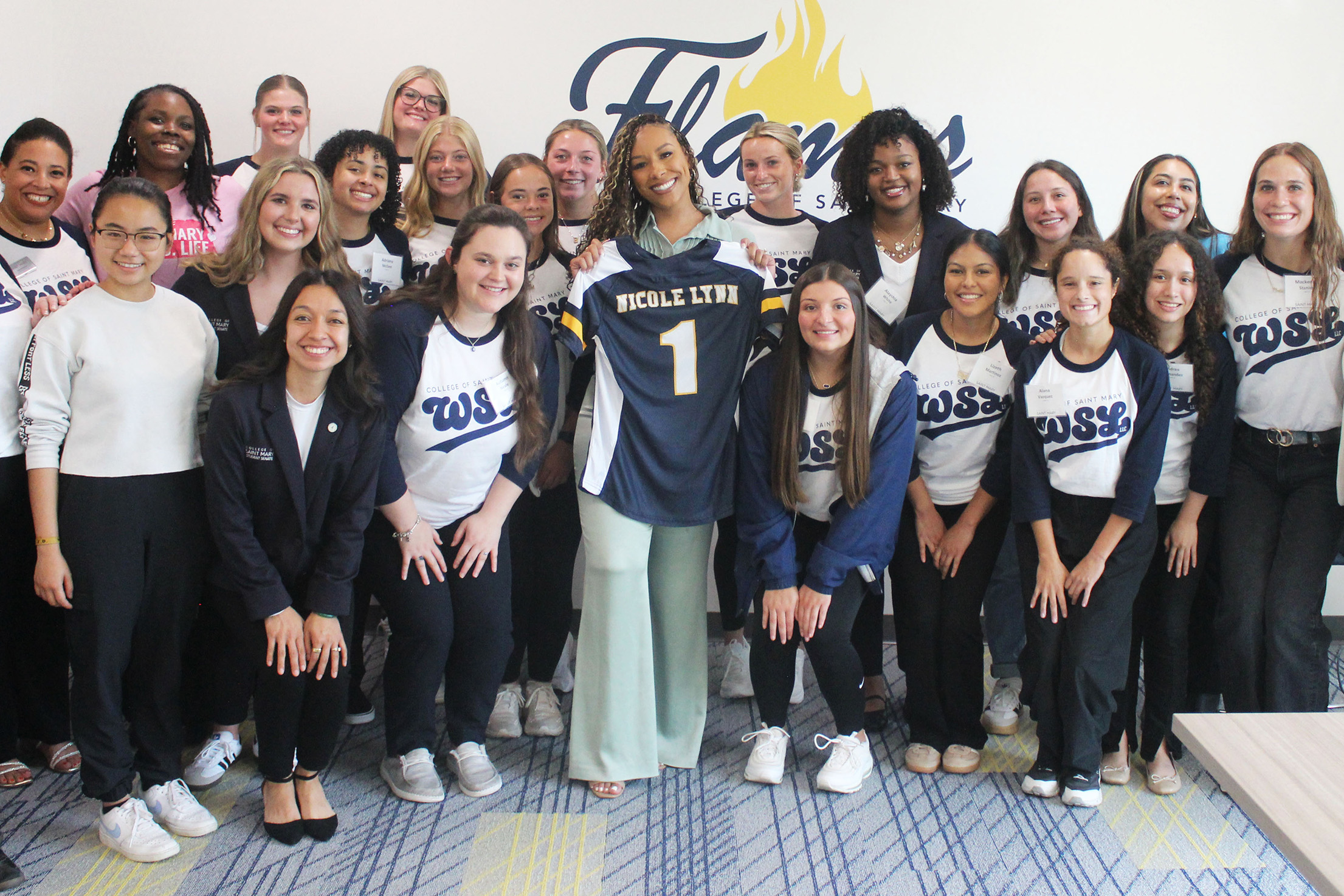Students who are part of the Sports Leadership Living and Learning Community meet sports agent Nicole Lynn on campus.